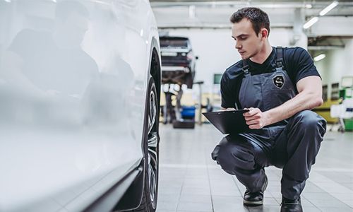 NJ Limo Fleet technician maintaining one of our stretch limos at our Avenel, NJ headquarters